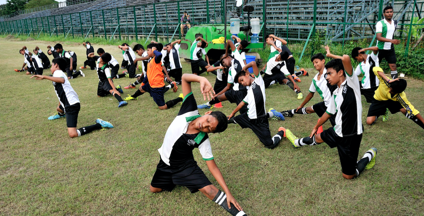 A national level football sporting club based in Kolkata, India, teaches football to a group of young boys from vulnerable communities. A national level football sporting club based in Kolkata, India, teaches football to a group of young boys from vulnerable communities.