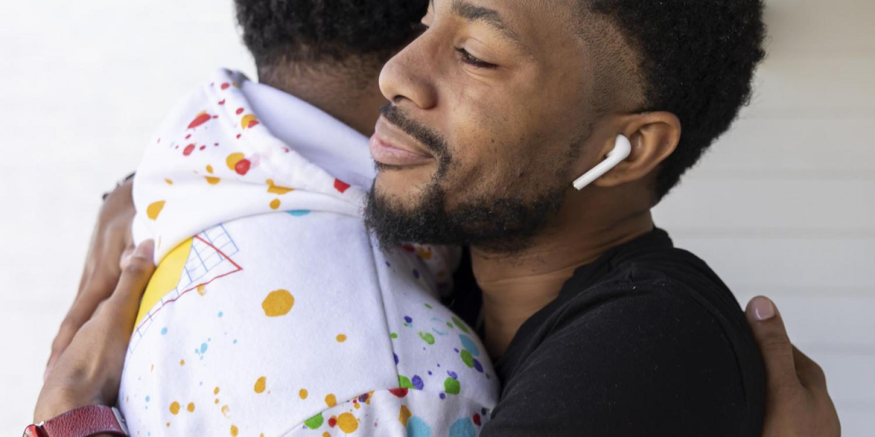 People living with HIV hugging